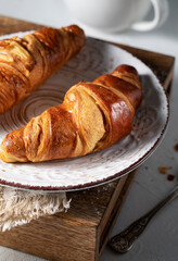 Fresh croissants on the morning table