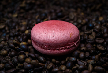 Attached purple macaroon, coffee beans on the table