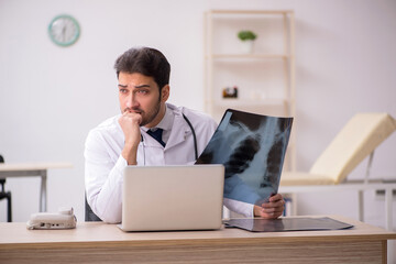 Young male doctor radiologist working in the clinic