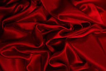 Fototapeta premium Rich and luxury red silk fabric texture background.