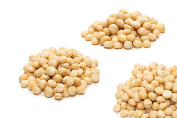 Macadamia nuts isolated on white background.