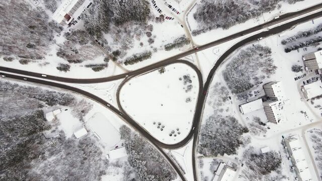 The transport ring in winter. A small traffic of cars driving on the road. Winter highways. Weather in Siberia