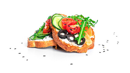 Bruschetta with cream cheese, salmon and vegetables isolated on a white background. Toasts...