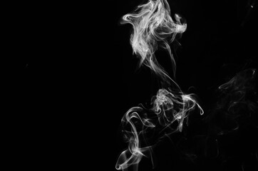 abstract fragment movement of white smoke on black background.
