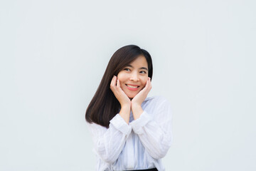 close up attractive adult business woman asian girl with happy and smile against white concrete wall office.