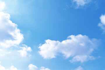 Obraz na płótnie Canvas Blue pastel colour sky with white clouds background.