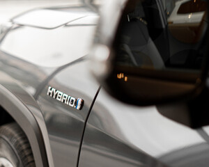 hybrid car Logo on the back side of automobile - obrazy, fototapety, plakaty