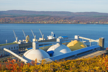 Warehouses on the shore for storage of bulk cargo have the form of a hemisphere