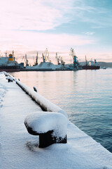 Autumn, Snow in the Murmansk seaport, Kola Bay, industrial ships.

The Kola Bay is located in the North of Russia (beyond the Arctic Circle). And this is the only non-freezing bay in the Russian Arcti