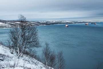 Autumn, Evening, Murmansk region, Kola Bay, industrial ships.

The Kola Bay is located in the North of Russia (beyond the Arctic Circle). And this is the only non-freezing bay in the Russian Arctic, s