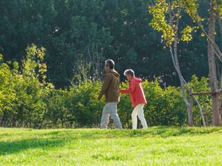 Happy old couple walking in the park