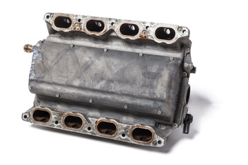 Intake manifold metal housing with a system for adjusting the air flow to the engine. Repair and replacement of spare parts of vehicles in a car service. - obrazy, fototapety, plakaty