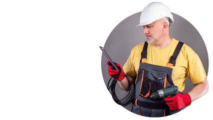 Repair of household appliances. Maintenance mobile app. Repairman with a smartphone. Man dressed as a repairman is holding a phone. Place for an inscription. Repairman search applications.