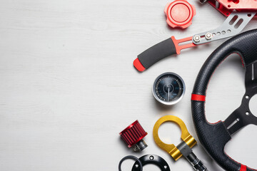 Car tuning gear concept flat lay background with copy space. Motorsport equipment.