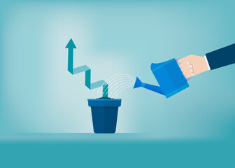 Hand of businessman watering growing graph in the pot
