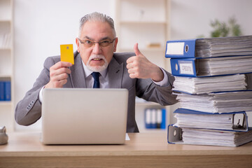 Old male employee unhappy with excessive work in the office