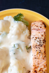 oven roast salmon with black pepper served with vegetables 