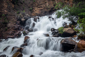 Waterfall in the mountains at peak run off