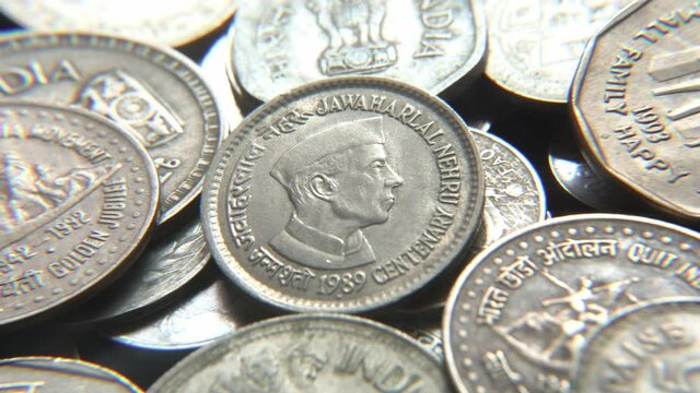 Stack of Indian vintage coins, Jawaharlal Nehru picture on a Indian vintage coin, selective focus, India