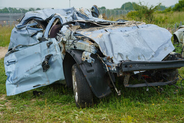 the crushed remains of a car after a British army Challenger 2 FV4034 tank has deliberately driven over it leaving just scrap metal  © Martin