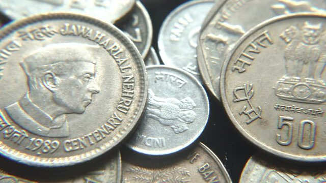 Stack of Indian vintage coins, Jawaharlal Nehru picture on a Indian vintage coin, selective focus, India