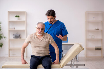 Old male patient visting young male doctor