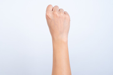A woman's hand lifted up symbol fist Represents the fight isolated on white background and clipping path
