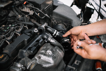 Fototapeta na wymiar Mechanic repairing car engine