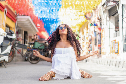 Beautiful Local Colombian Woman In White Dress In The Walled City Of Cartagena, Colombia