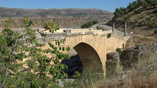 Adiyaman, Turkey - 17th of June 2021: 4K At the Nemrut mount tour - Side view on the ancient Roman bridge of Cendere
