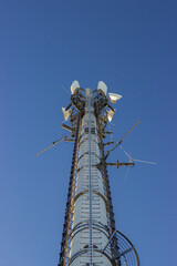 5g transmission tower on a blue sky background