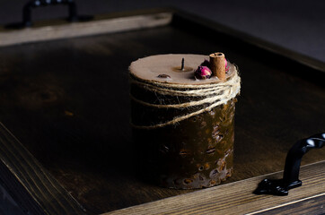 A large extinct cinnamon candle. In the dark