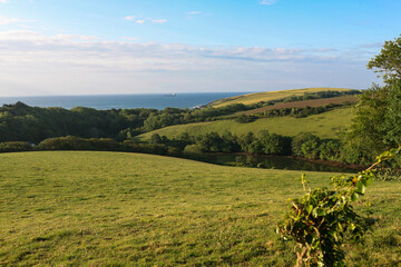 View over Porth Creek down towards Towan Beach and the English Channel beyond: Roseland Peninsula,...