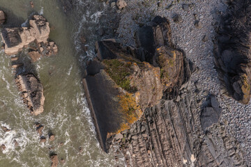 Stunning aerial drone flying landscape image of Blackchurch Rock on Devonian Geological formation