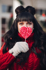 Beautiful woman with red lollipop.