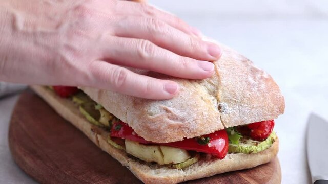 Cooking sandwich with grilled vegetables, cheese and ciabatta. Vegetarian cooking concept.