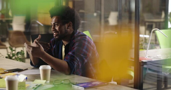 Young millennial african american jobseeker having an interview with hr manager. Creative employee talking at modern office - business people 4k footage
