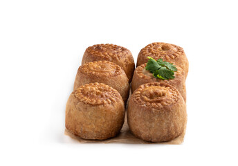 Mini Melton Mowbray pork pies isolated on white background