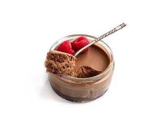 Mini caramel cheesecake in a glass pot with spoon isolated on white