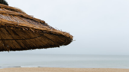 Bamboo cane sunshade against the sea