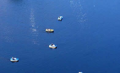 Top view of boats on the sea surface.