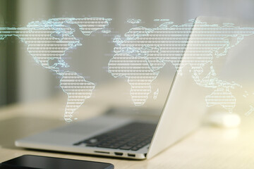 Abstract creative world map on modern laptop background, international trading concept. Multiexposure