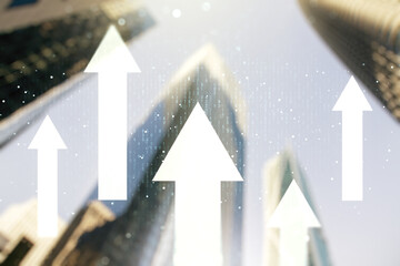 Double exposure of abstract virtual upward arrows hologram on modern skyscrapers background....