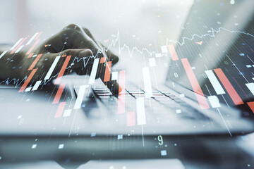 Creative concept of crisis chart illustration with hands typing on laptop on background. Global crisis and bankruptcy concept. Multiexposure