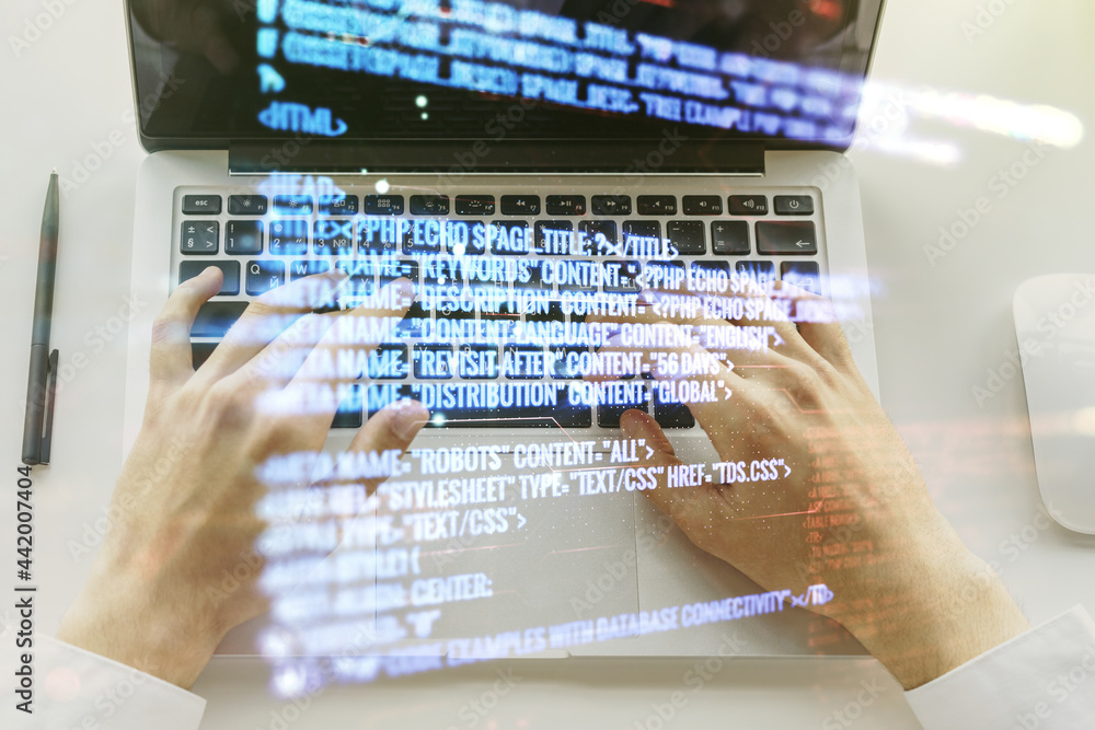 Poster double exposure of abstract programming language hologram with hands typing on laptop on background,
