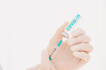 Doctor with syringe is ready to administer the vaccine against covid-19