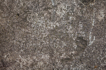 Stony texture with traces of corrosion. Old stone with stains and scratches. Abstract grunge background