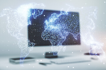 Abstract creative world map on modern laptop background, international trading concept. Multiexposure