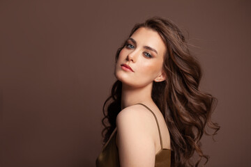 Beauty hair woman. Young pretty lady with stylish curly hairstyle