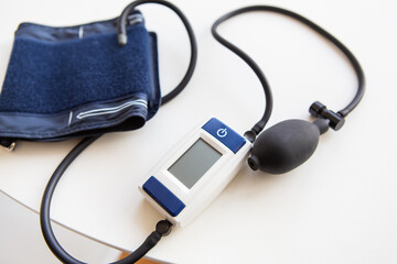 Measurement of blood pressure. A device for measuring blood pressure on a woman's hand. Health...